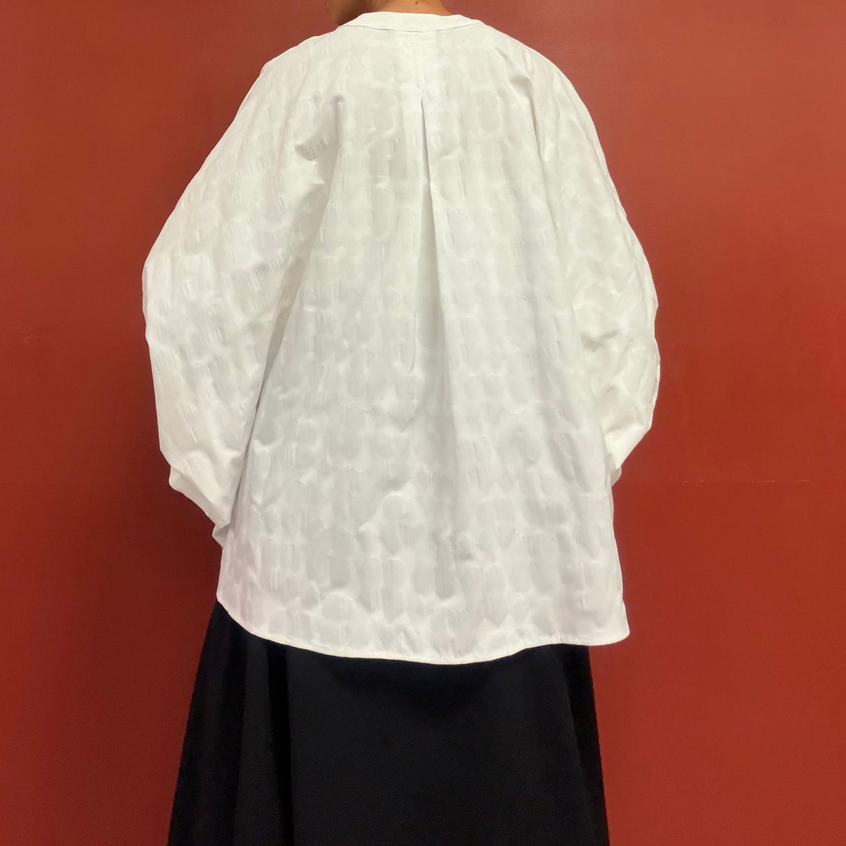 Dolman sleeves blouse with subtle flower texture