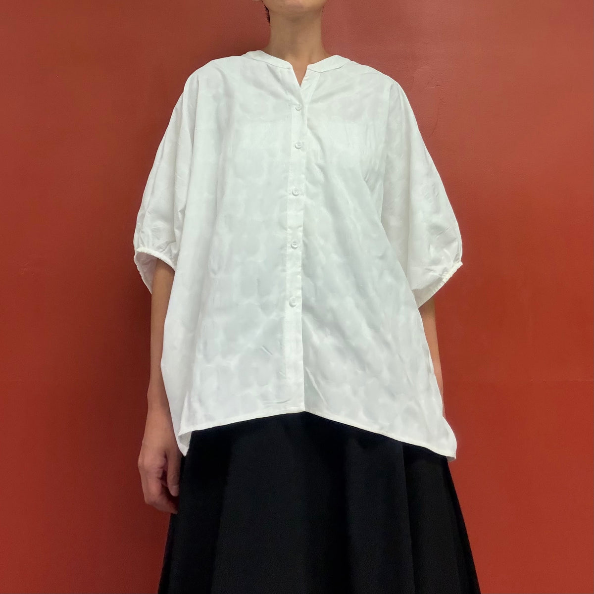 Dolman sleeves blouse with subtle flower texture