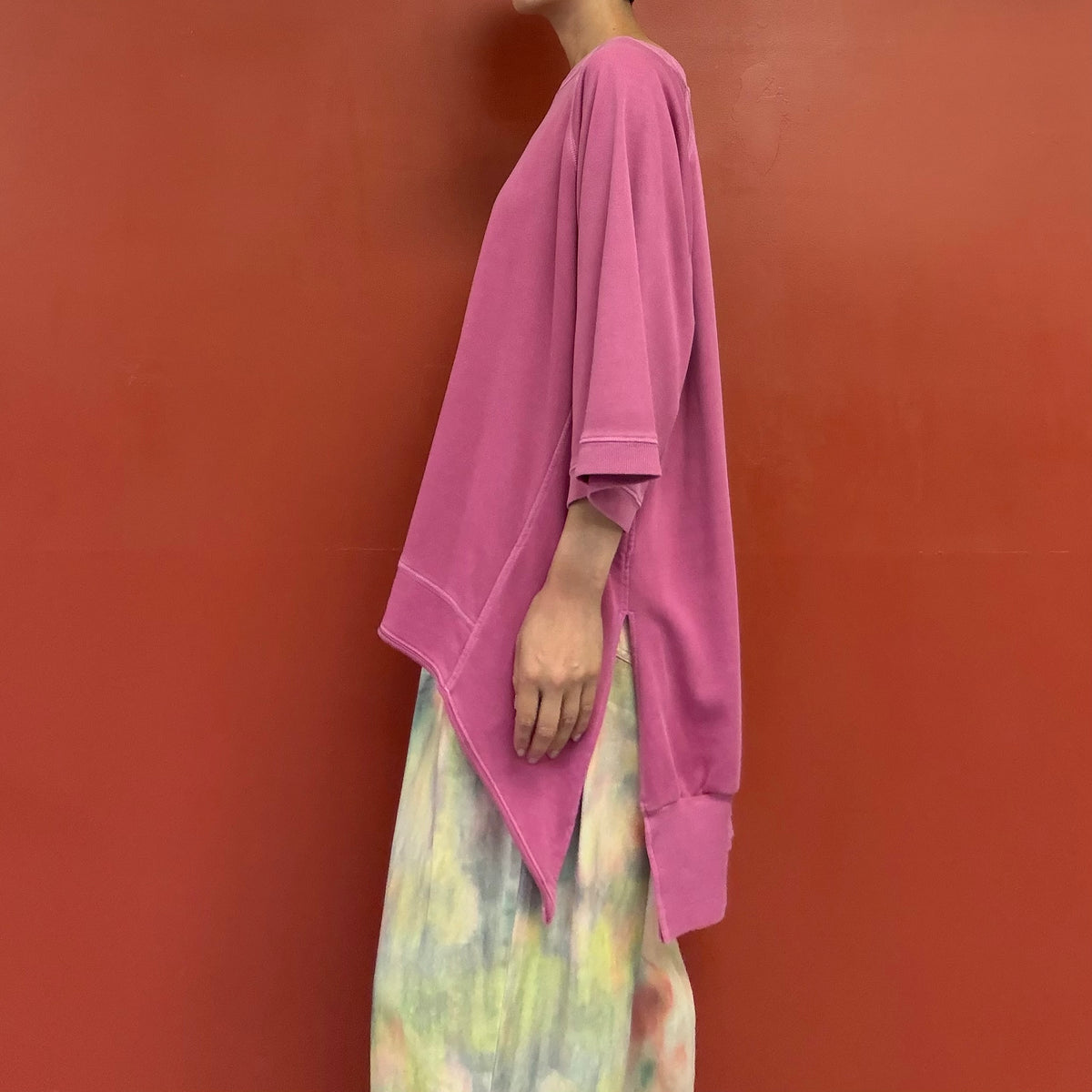 Asymmetrical draped tunic top