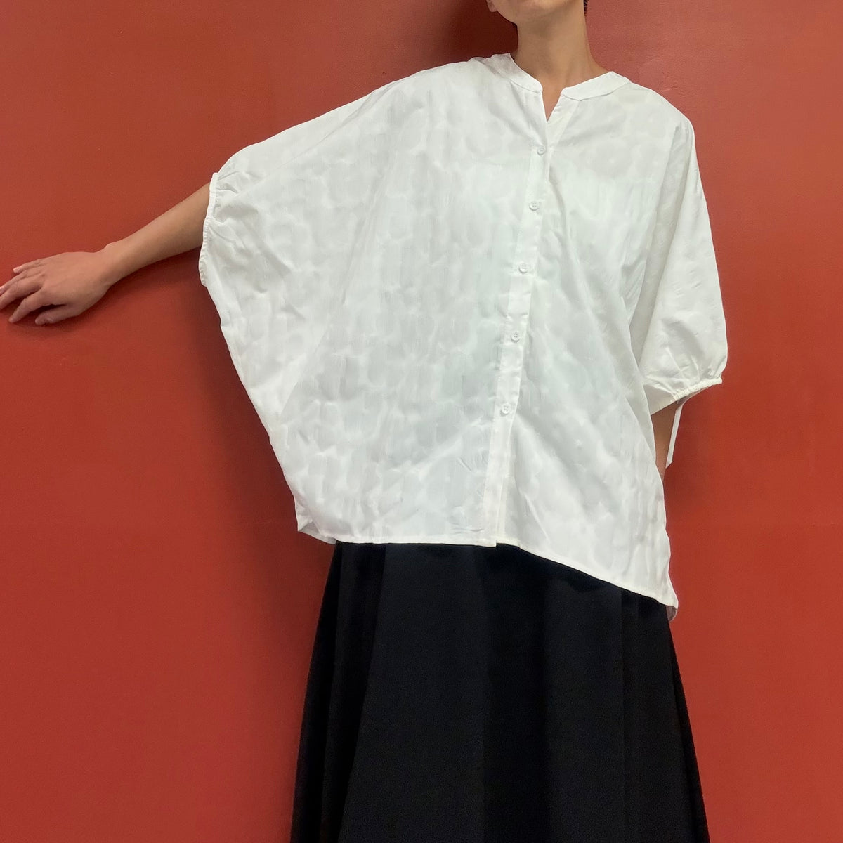 Dolman sleeves blouse with subtle flower texture
