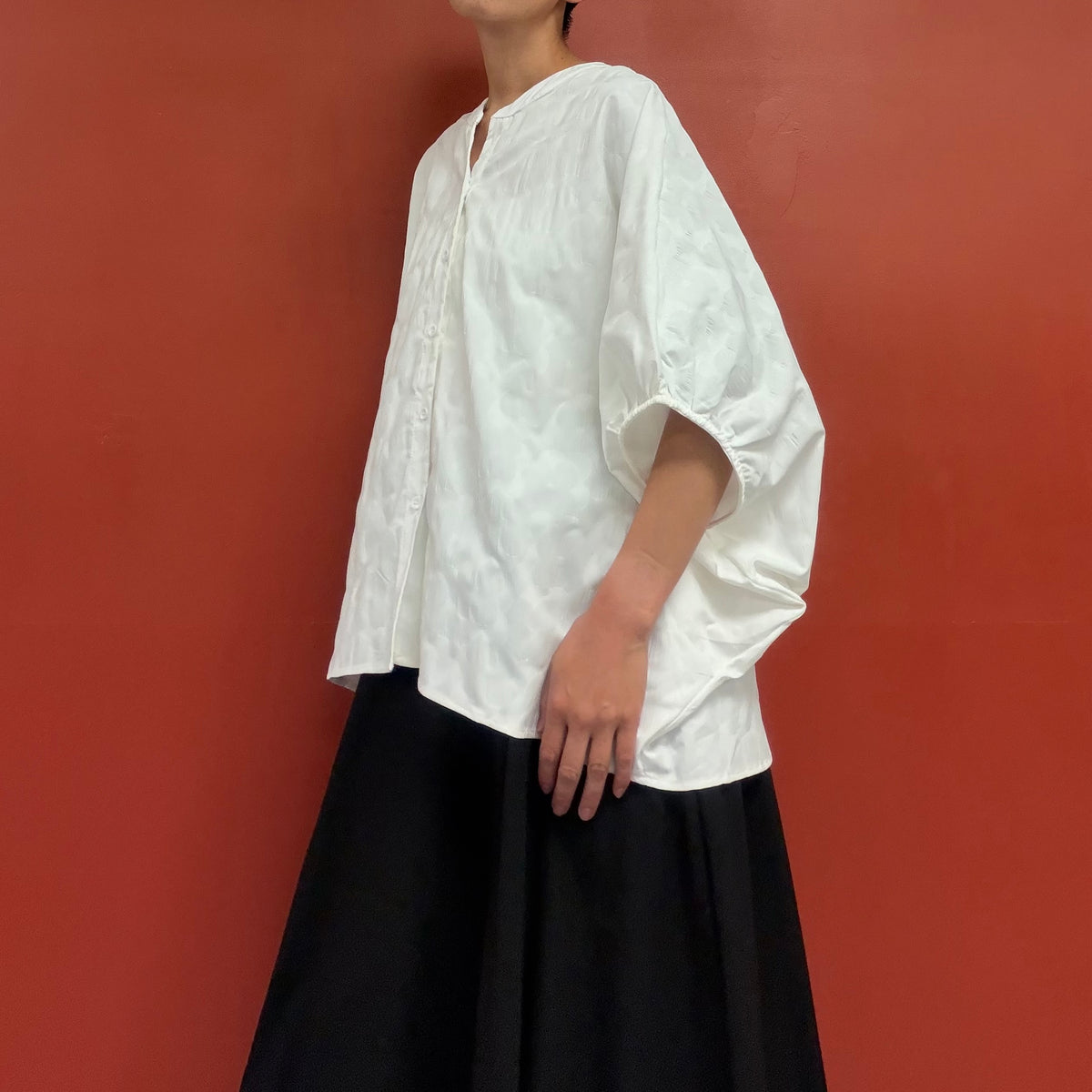 Dolman sleeves blouse with subtle flower texture