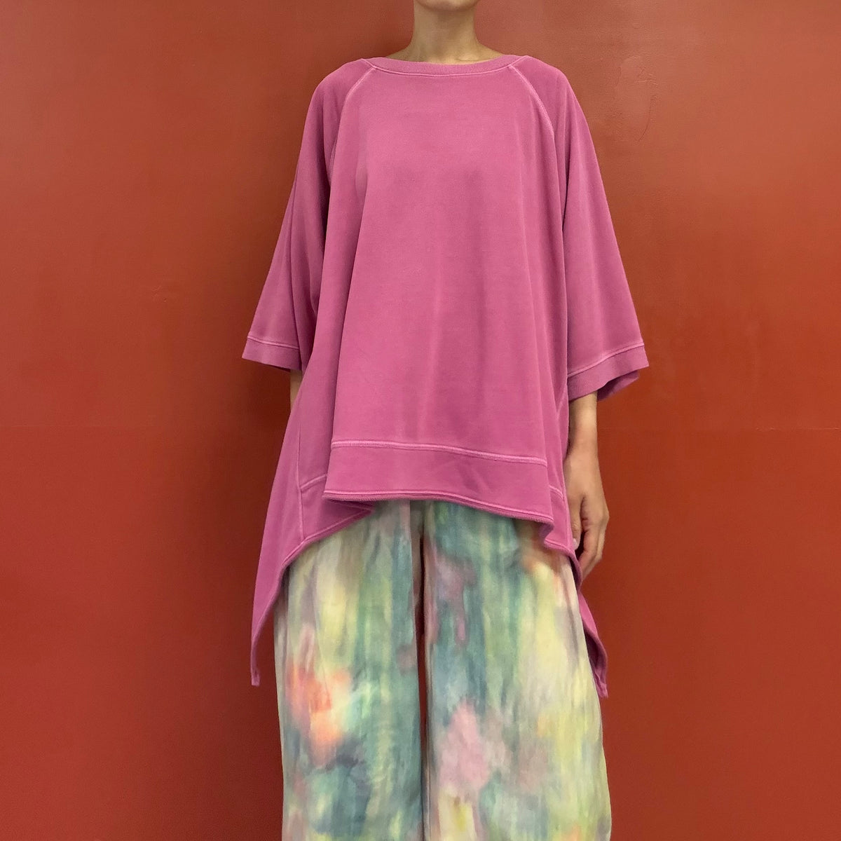 Asymmetrical draped tunic top