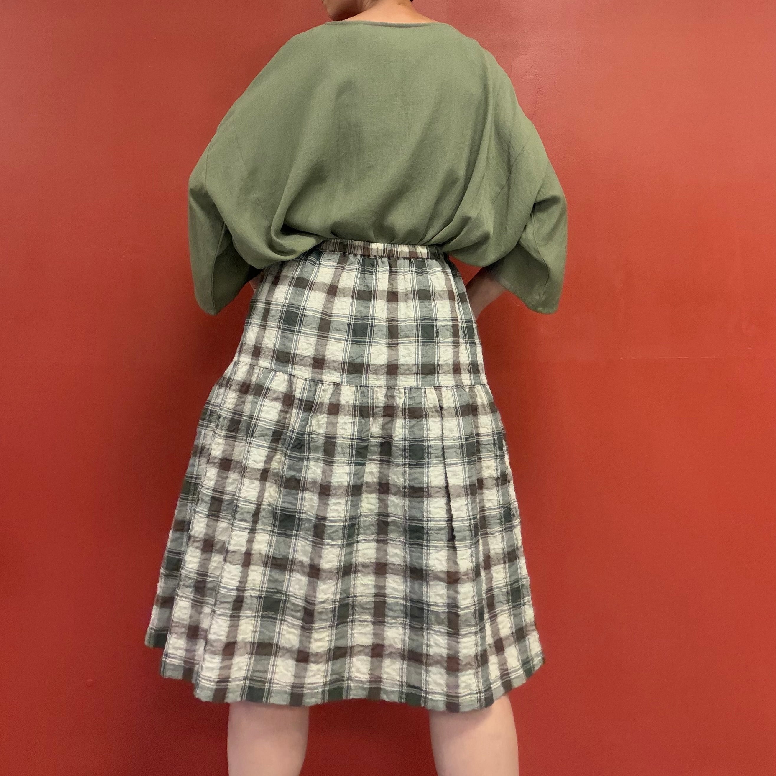 Draped pocket check skirt