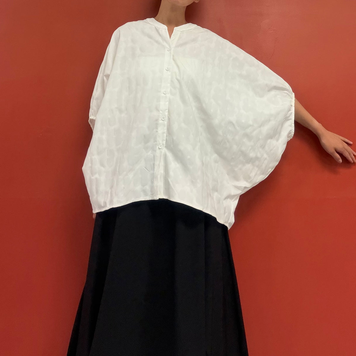 Dolman sleeves blouse with subtle flower texture